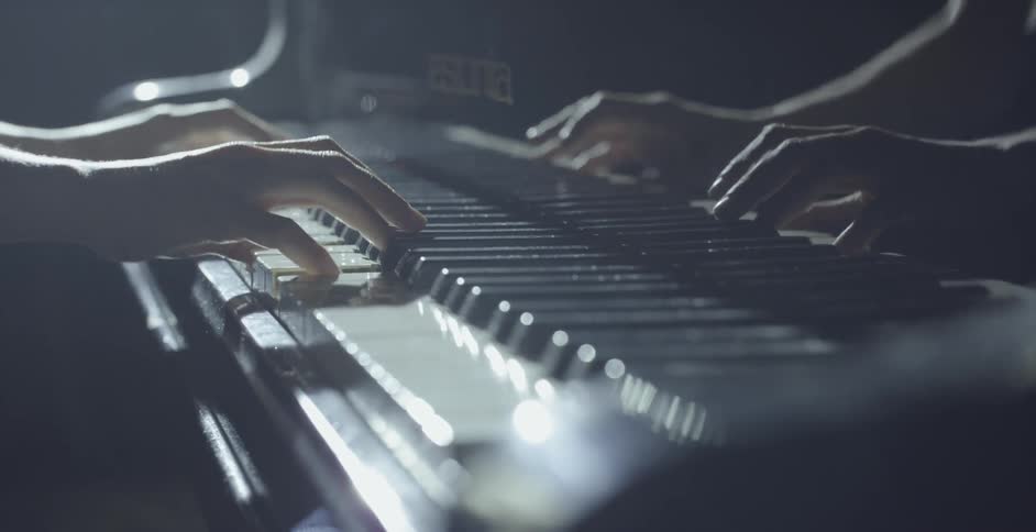 A pianist plays the piano