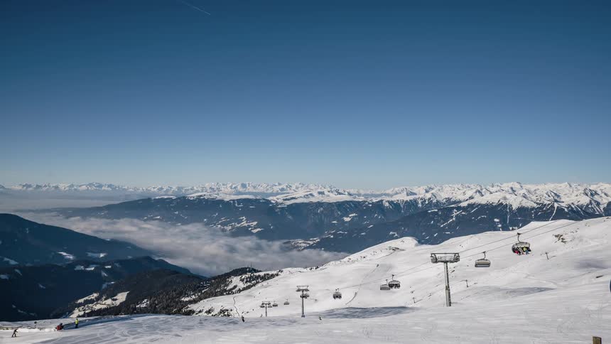 Ski lifts travel up and down the mountain