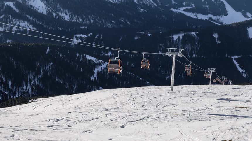 Ski lifts travel up and down the mountain