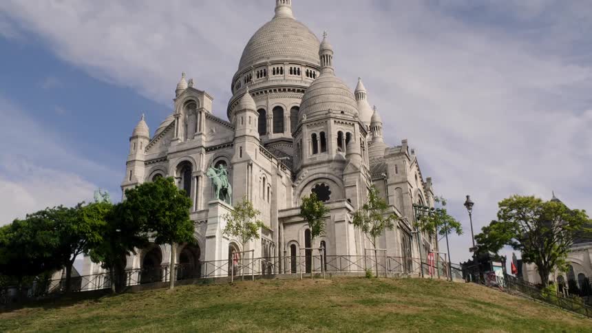 A large domed building sits on a hilltop