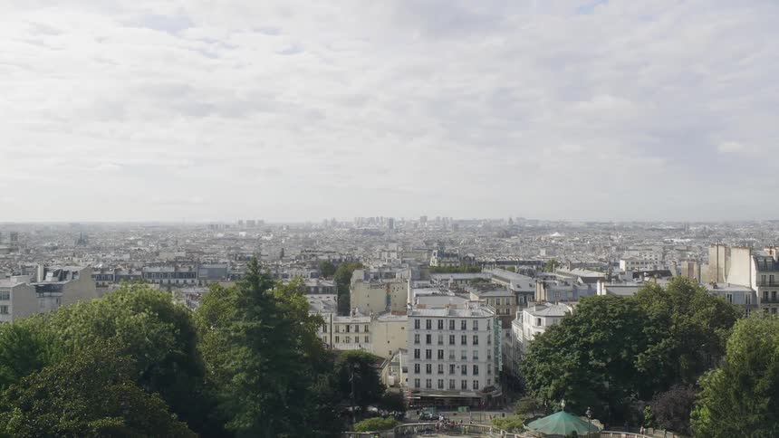 Clouds hang above a large city