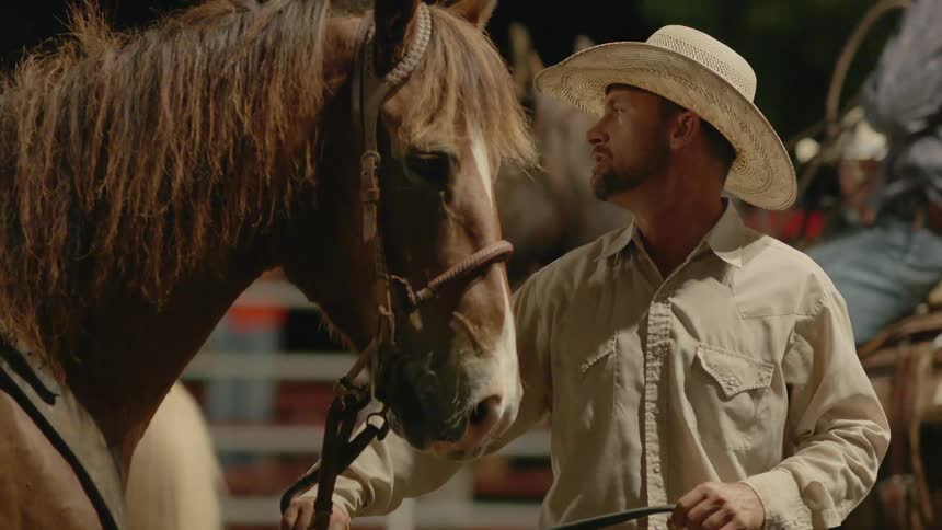 Cowboys ride horses and lead them by the reigns