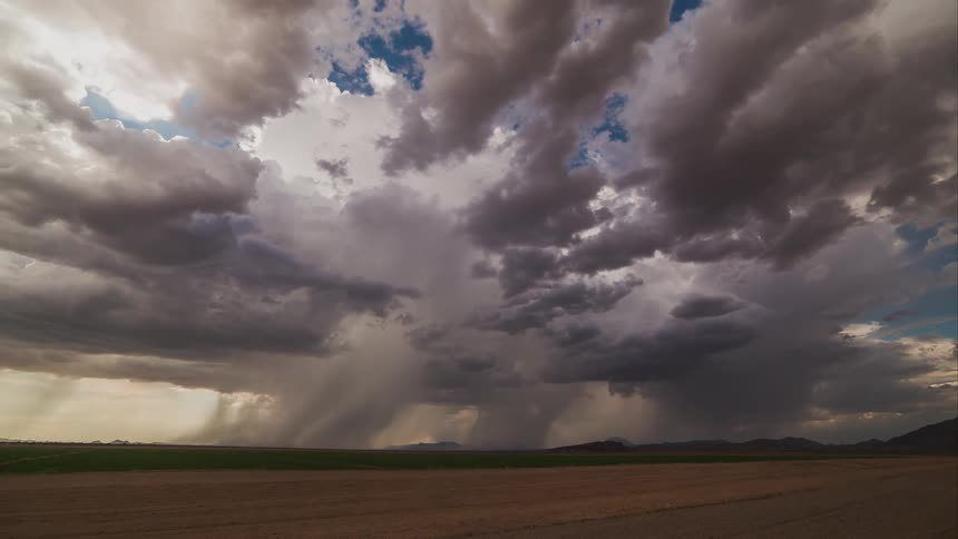 Time lapse of storm clouds moving over a rural area