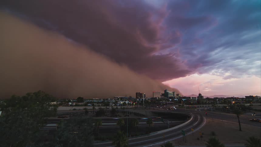 Time lapse of busy intersection as a large storm passes over the area