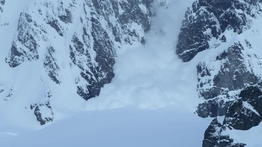An large violent avalanche falls down the mountain