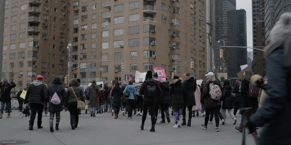 Protesters march on a city street