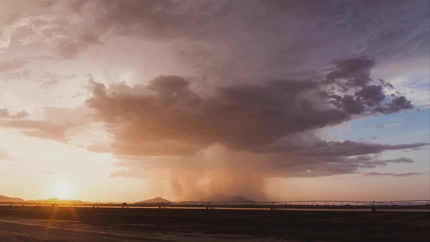 Time lapse from a road as a storm forms in the distance