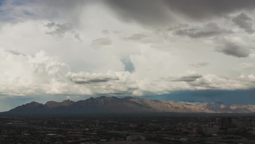 Clouds float over a valley
