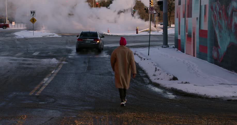 A man walks down a city street