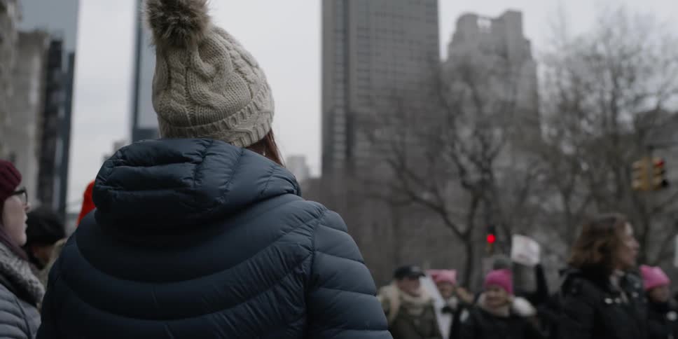 Protesters walk on city streets