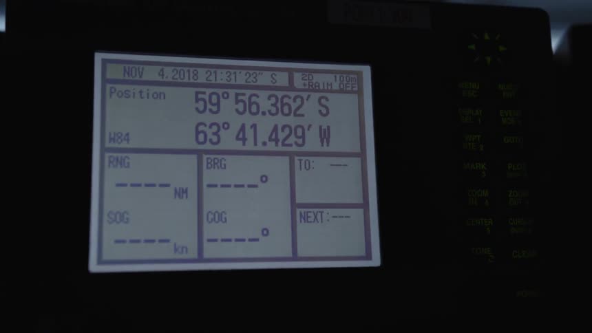 Boat electronics screen with latitude and longitude coordinates