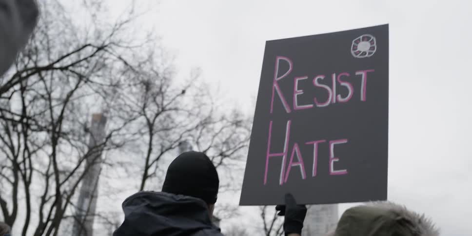 Protesters walk on city streets