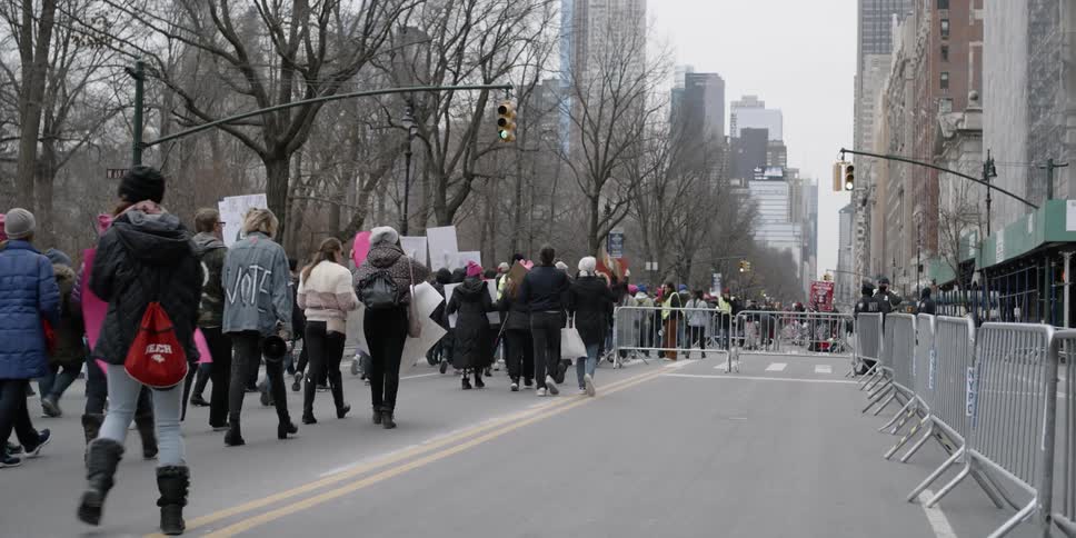 Protesters march on a city street