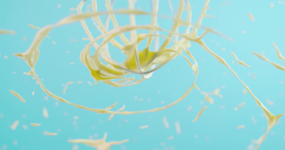 A batter mixer spins and throws batter everywhere