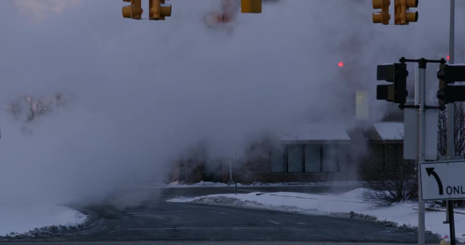 Steam pours out onto the street