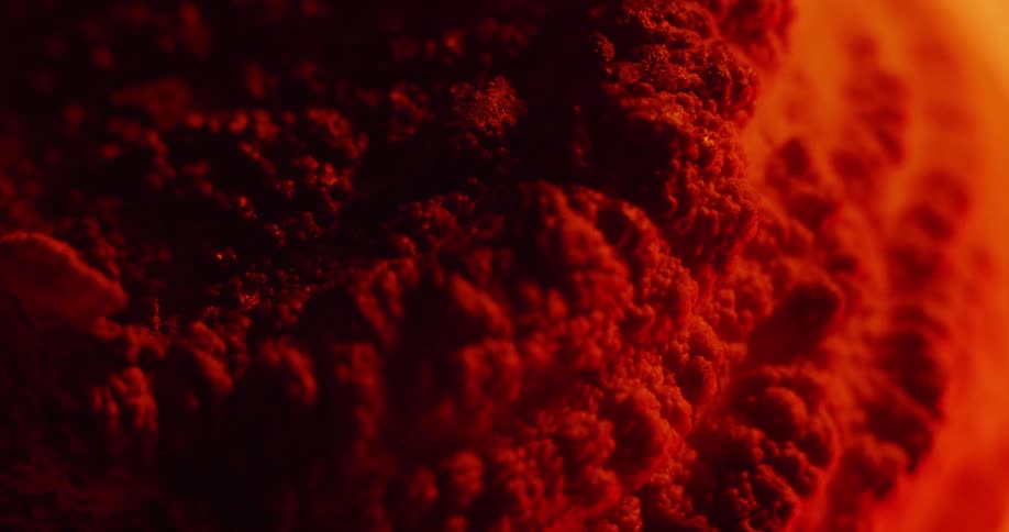 The surface bubbles and expands as it heats