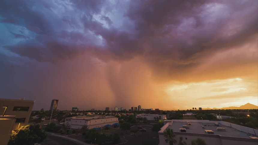 Time lapse of a town as a large storm forms ahead