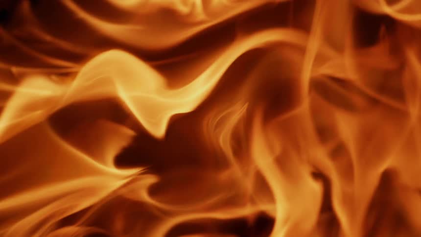 The fire rages with flames spinning around