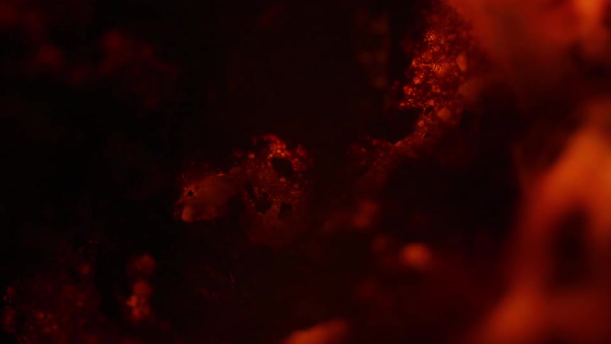 Orange surface bubbles and darkens as it heats
