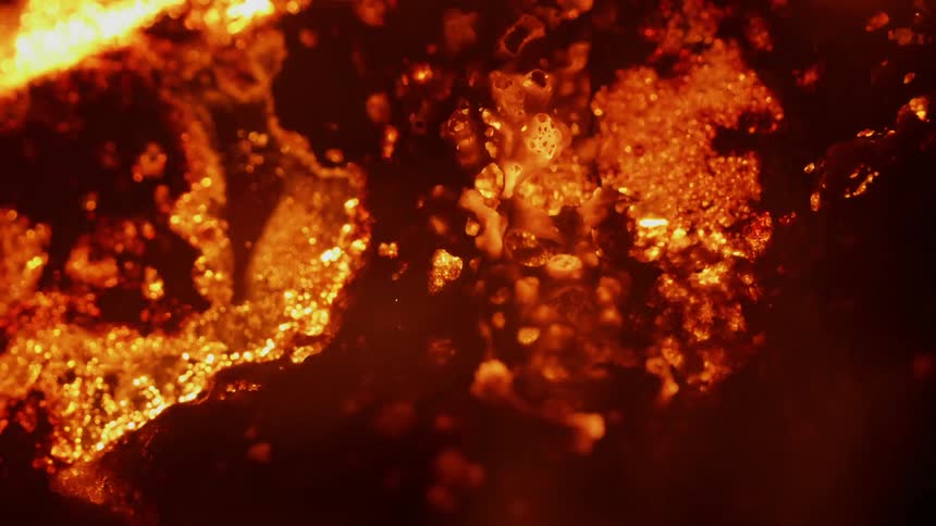Embers glow and burn in heat and fire