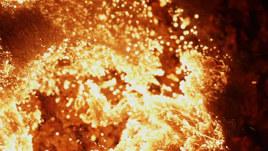 A fire burns through fibers