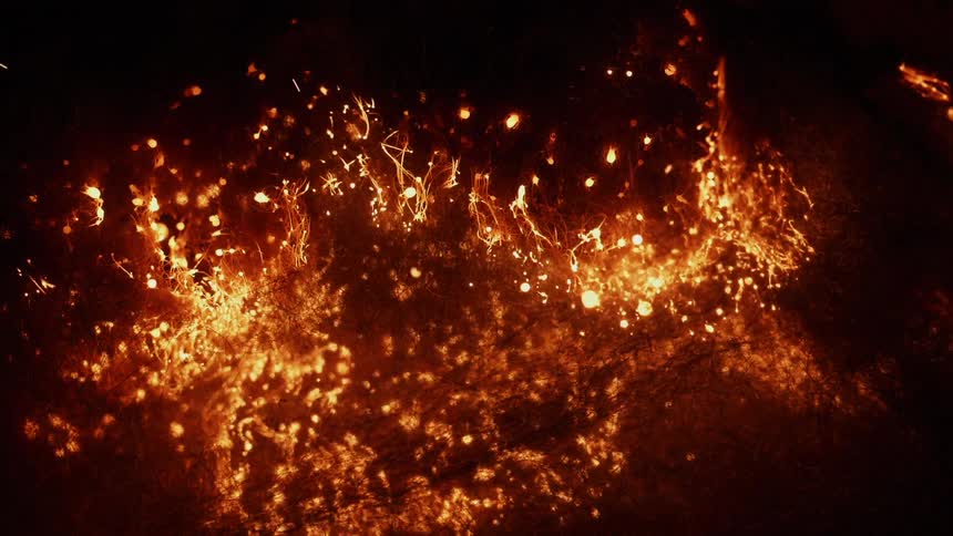 The tinder burns and sparks at night