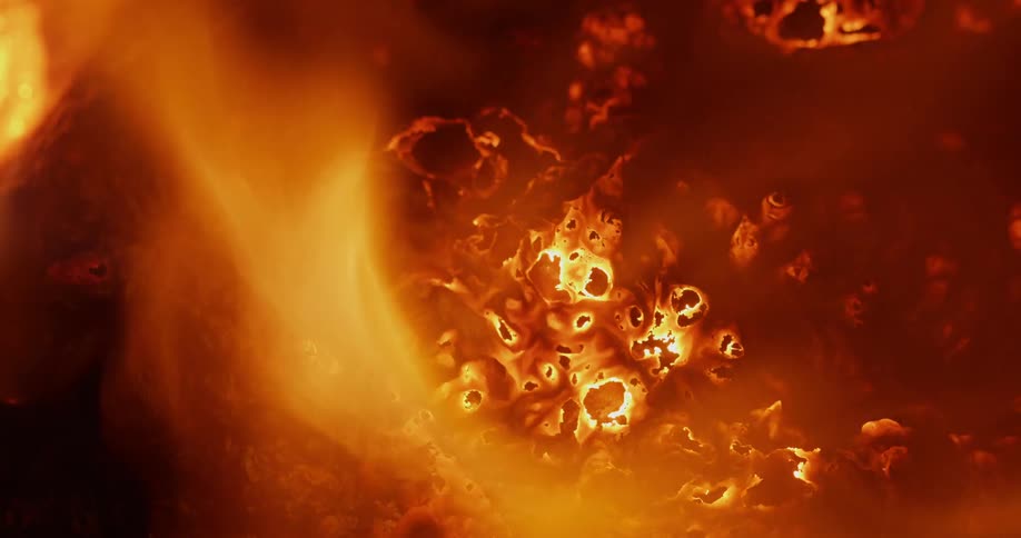 Flames burn brightly from the embers