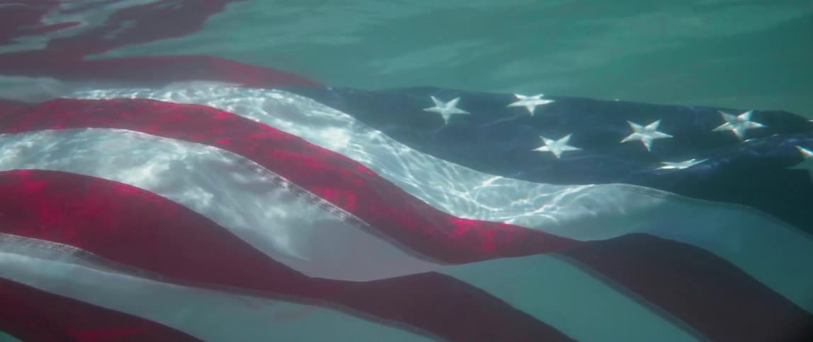 An american flag sinks underwater