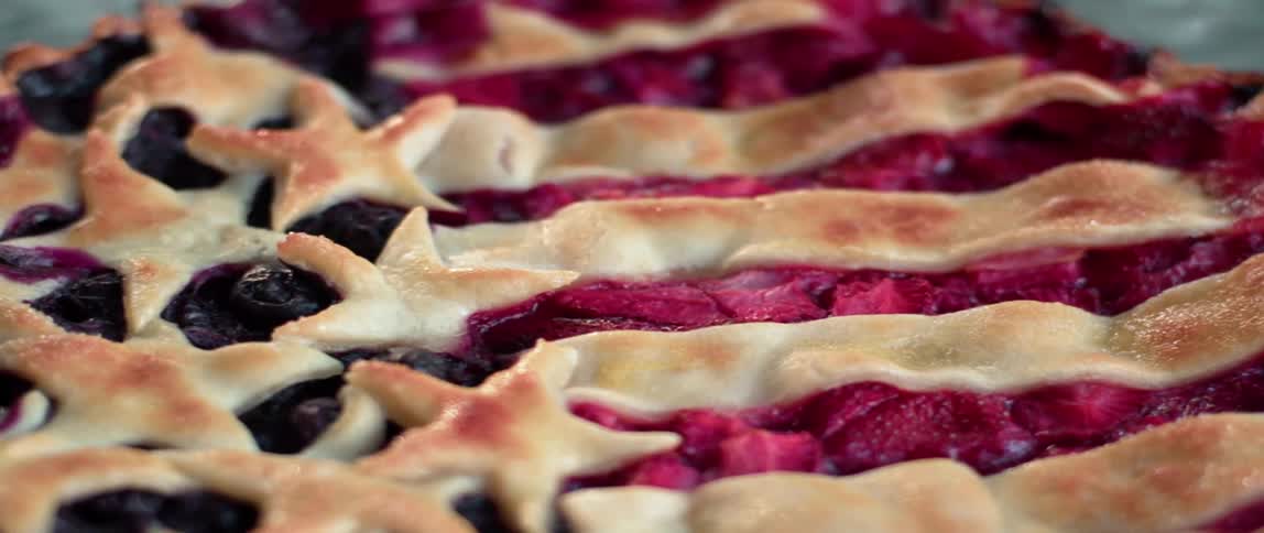 A berry pie is decorated like an american flag
