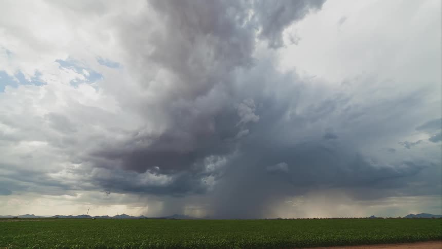 Timelapse of cloud formations and rain storm in the distance
