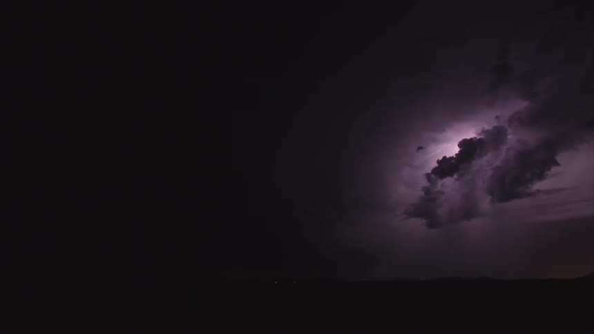 Time lapse of a large storm with lightning flashing all over
