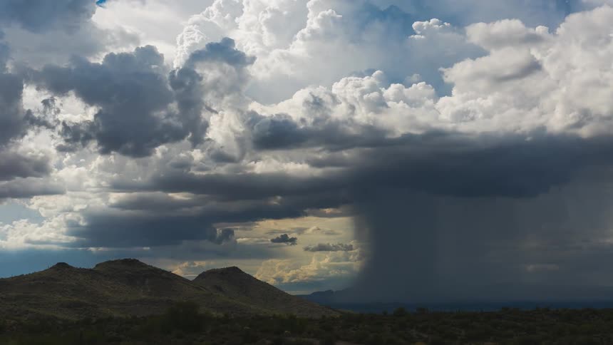 Clouds float over a desert