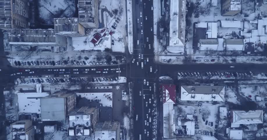 Cars travel through a city intersection
