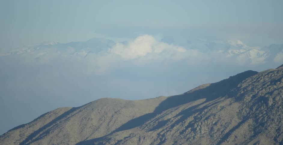 Clouds pass above the mountains