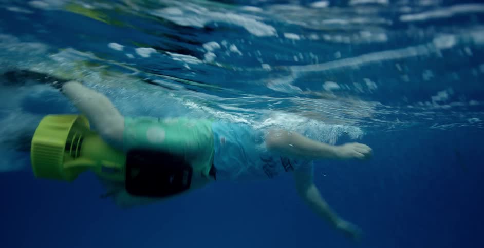 Diver gives a thumbs up as he swims up to the surface