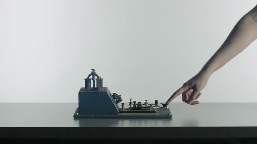 A person presses the button on a machine
