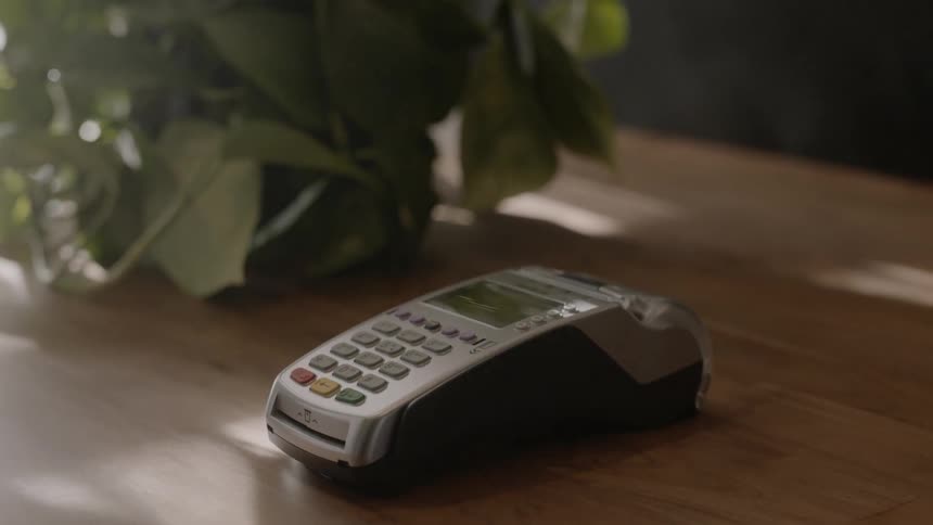 A man makes a payment with a smartphone