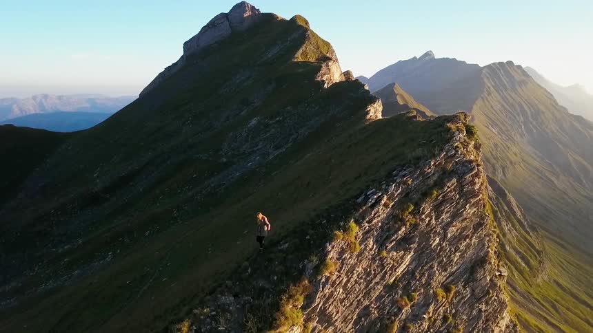 Mountains sit under a blue sky