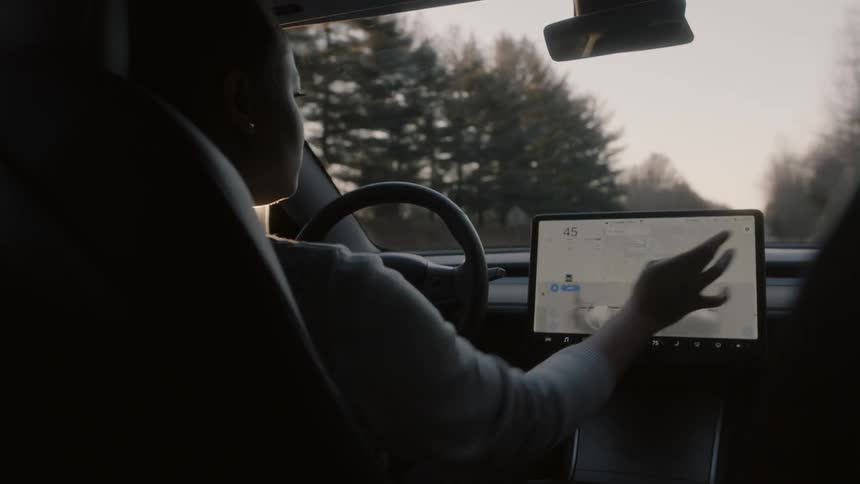 A person is driving the car on a cloudy day