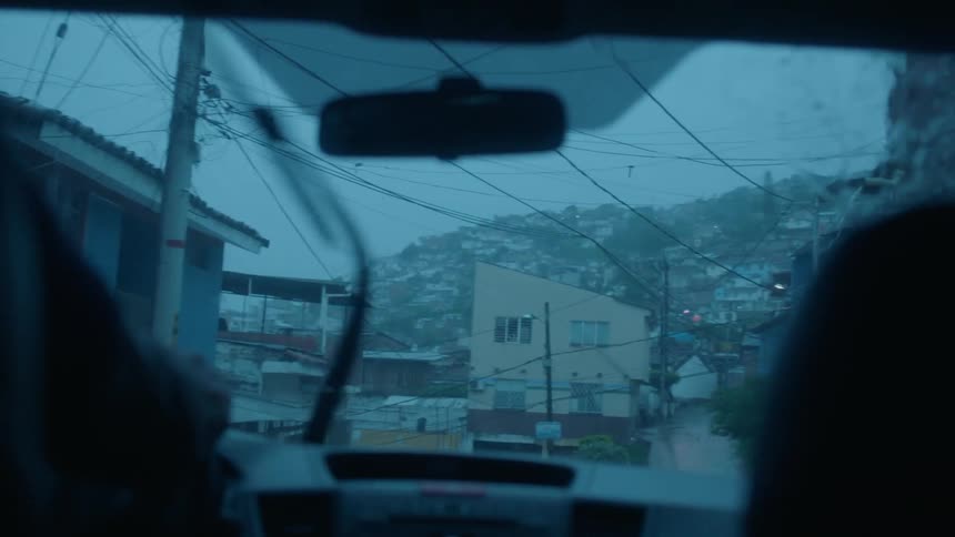 Windshield wipers move back and forth on the windshield