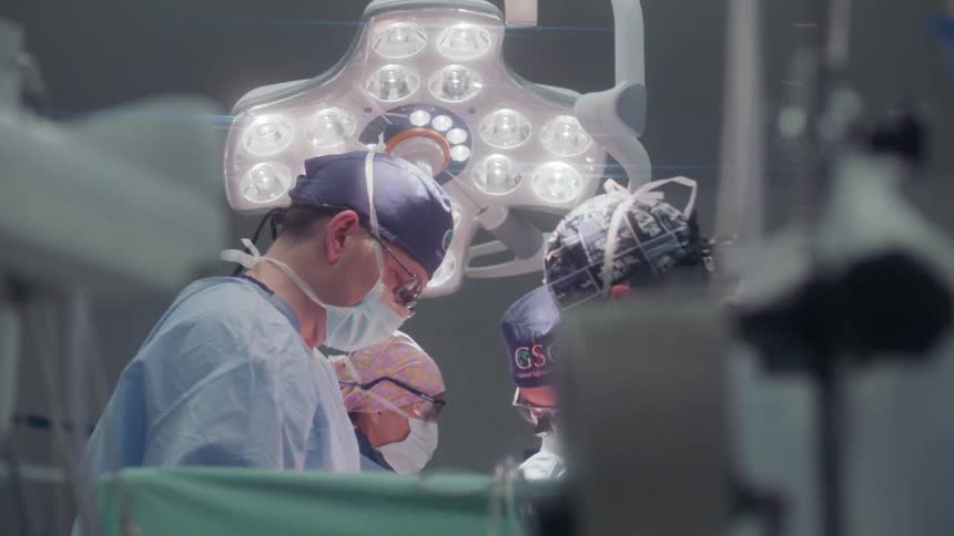 The surgeons are working on a patient