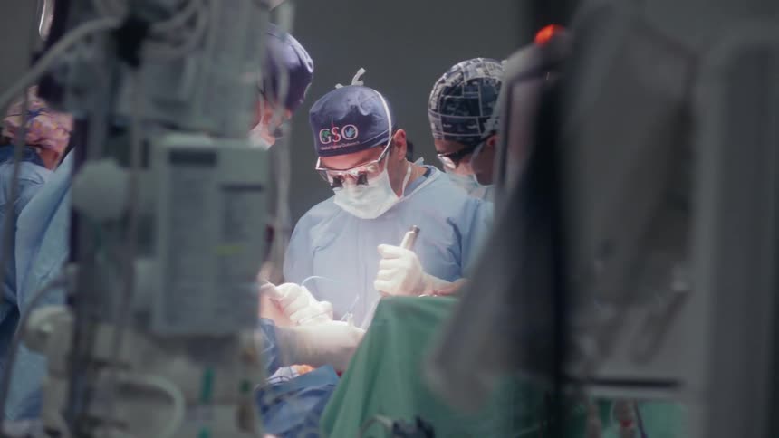 Surgeons work on a patient in the hospital