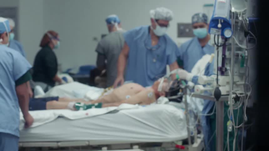Doctors surround a patient in the hospital