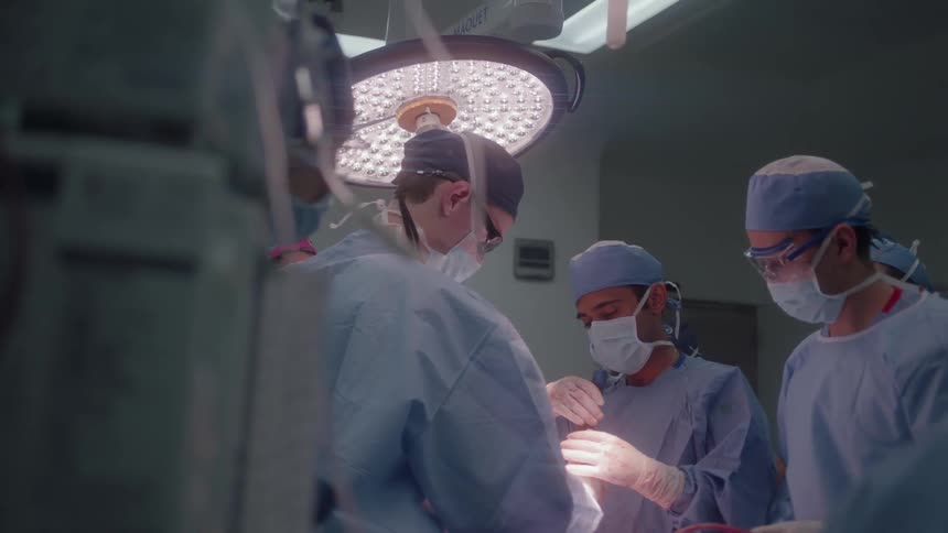 Doctors operate on a patient together in the hospital