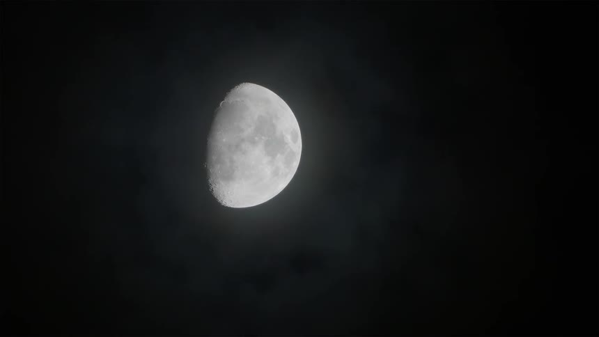 Full moon shows partially in the night sky