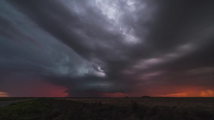 A lightning storm with amazing sunset colors