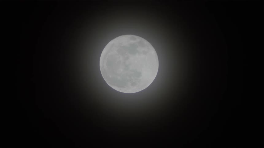 Moon shines brightly at night