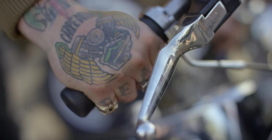 A person turns the handle on the motorcycle
