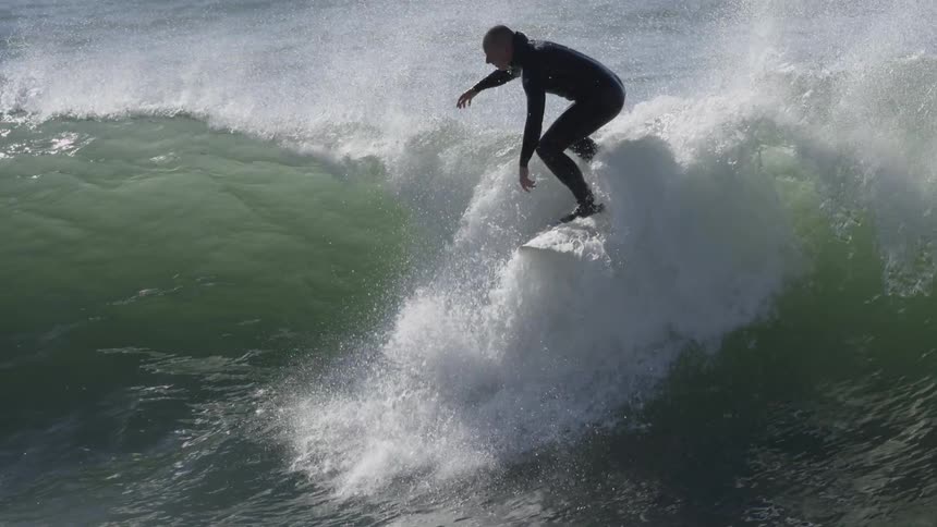 A surfer is riding a wave