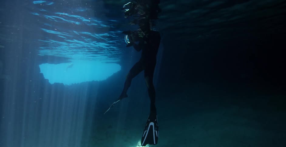The diver has his head just above the water